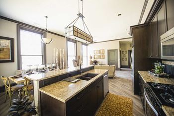 Kitchen island with granite countertops and dining area